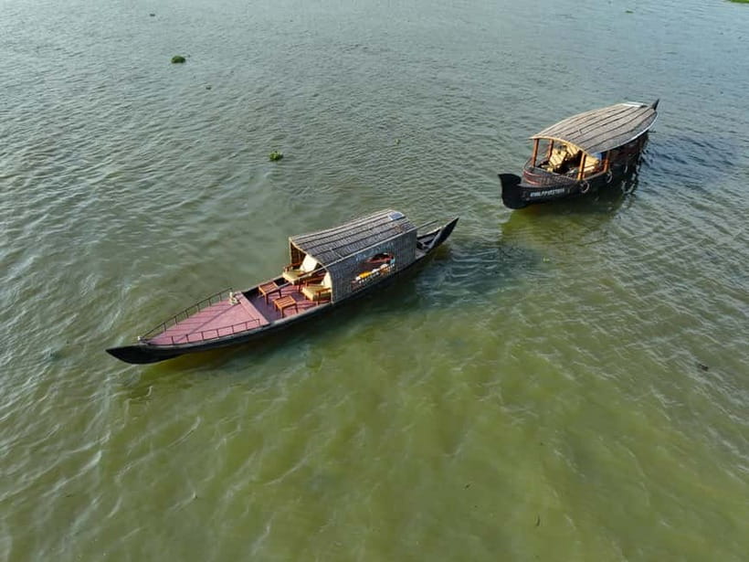 Kumarakom: Sunrise Cruise With Village Life and Local Food - Fishing nets in motion: watching skill, not just boats